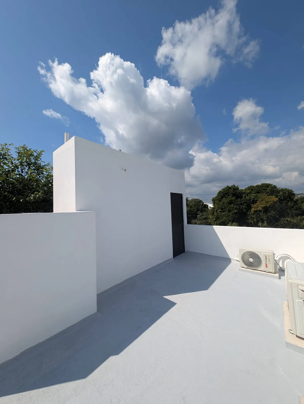 Private rooftop terrace under a blue Caribbean sky