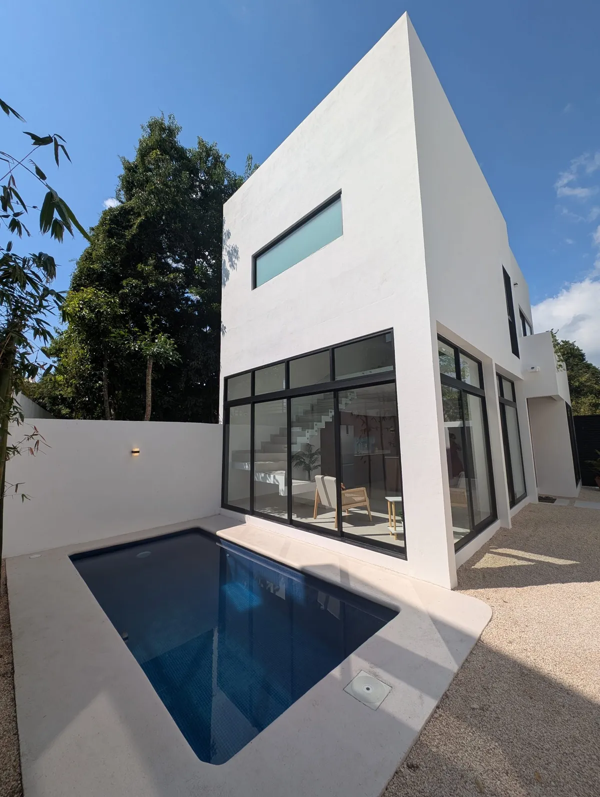 Modern white two-story home with a private pool in Puntarena, Puerto Morelos